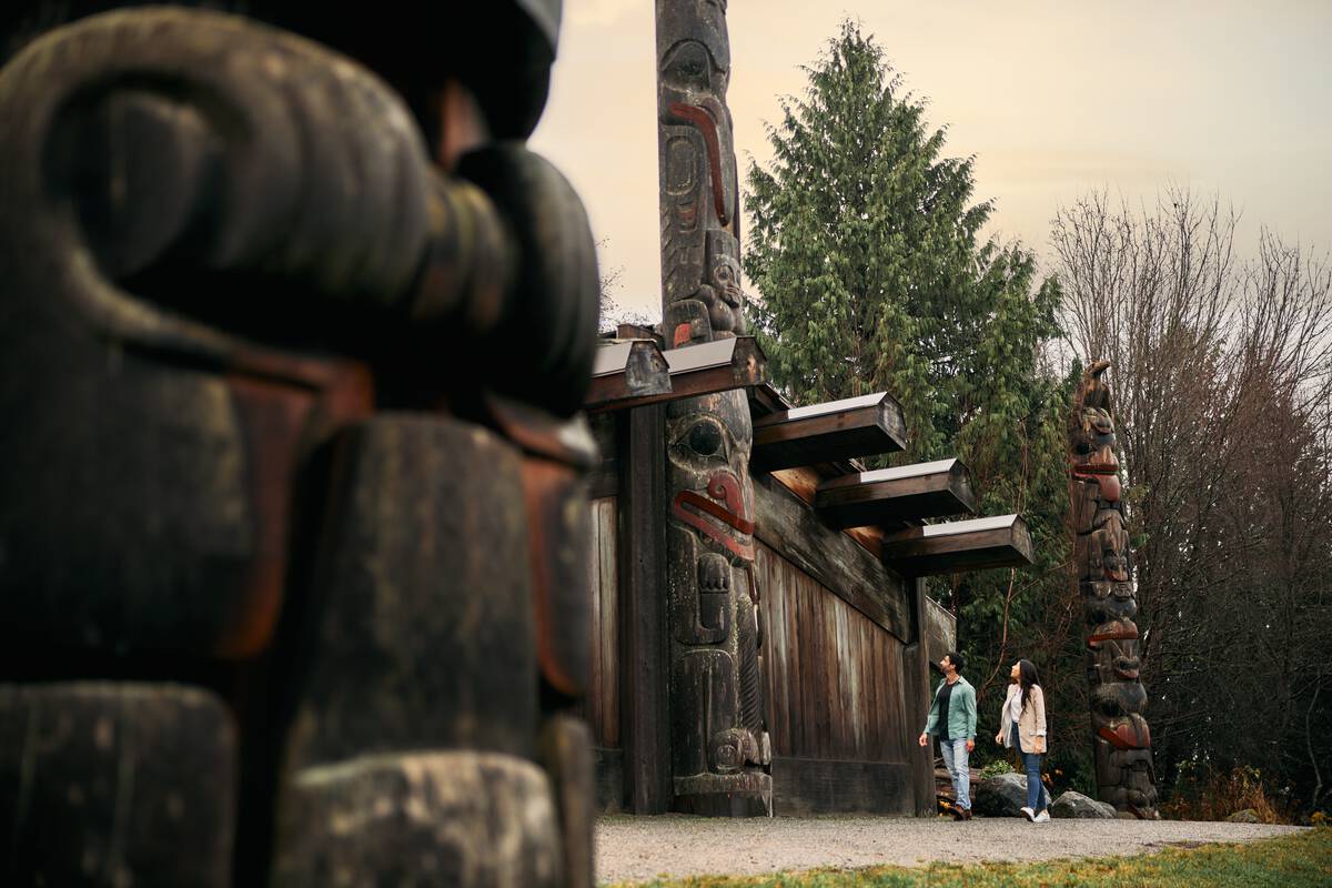 A couple is exploring the Museum of Anthropology in Vancouver.