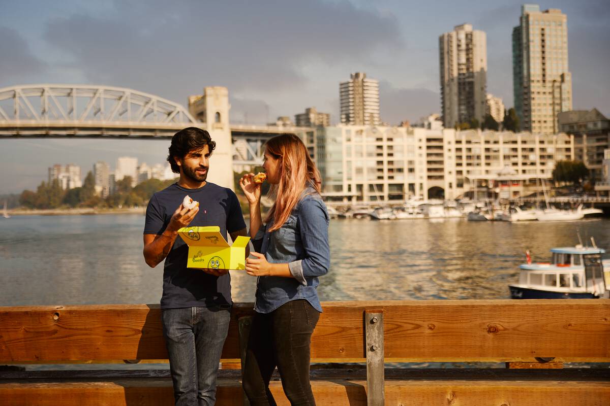 Enjoying Lee's Donuts at Granville Island Public Market