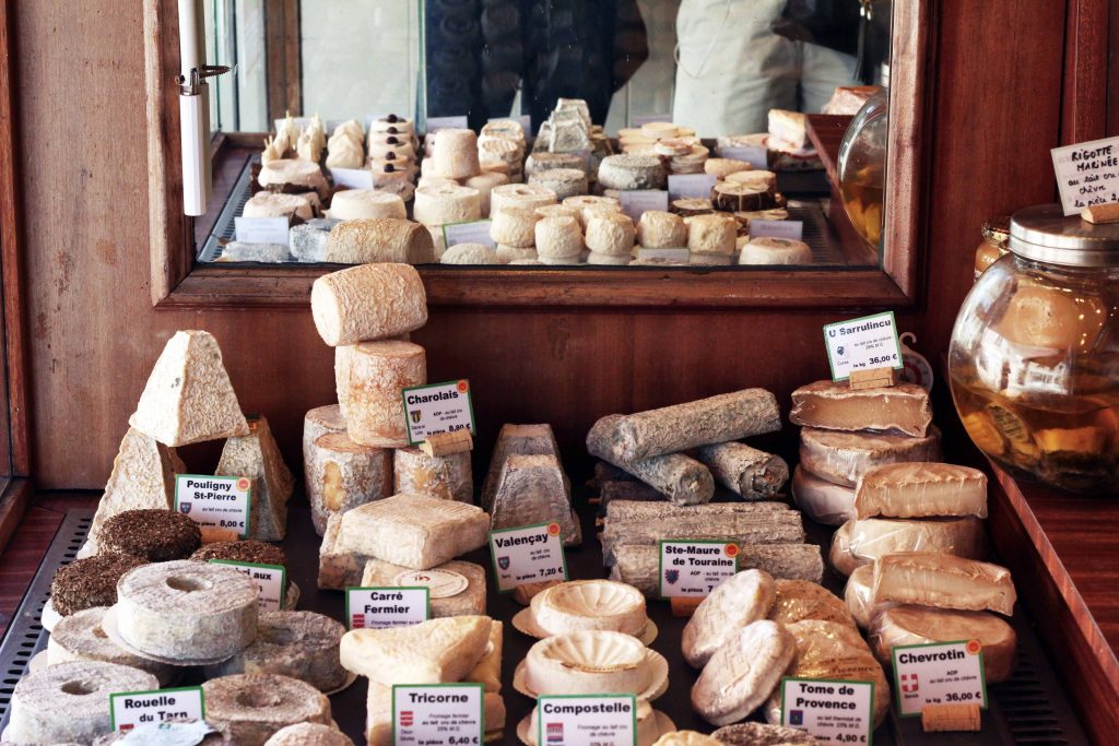 The Savoie Cheese Route - cheeses laid out in a  Savoie cheesemongers
