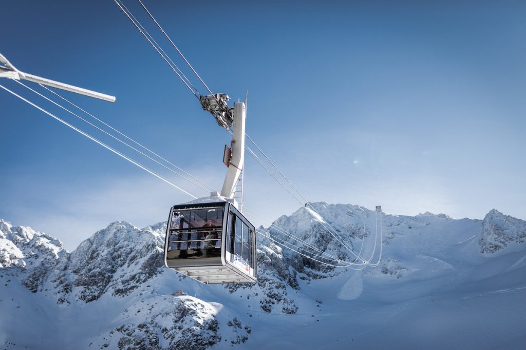 Cable car ascending Mont Fort in Verbier in the Swiss Alps