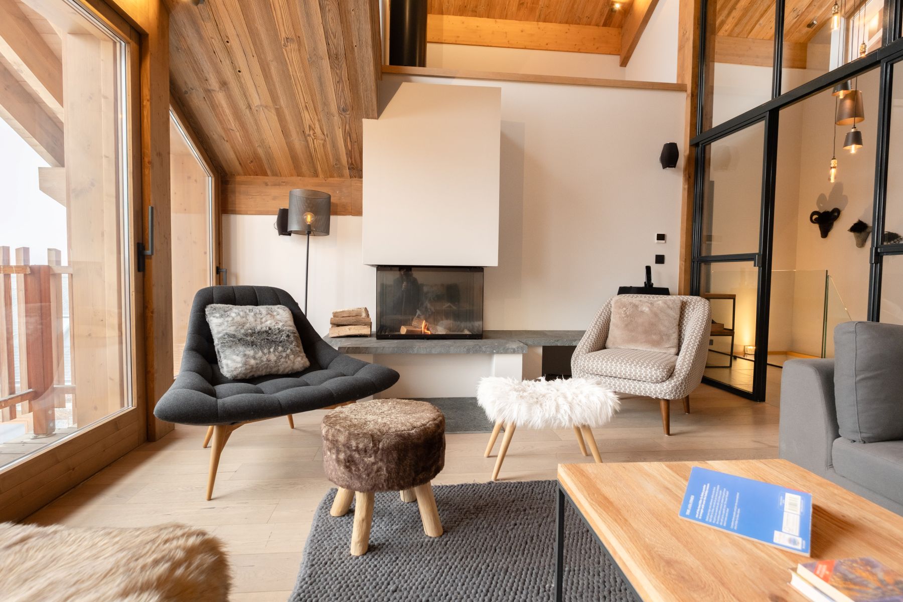 Chalet Caro, Meribel - bright lounge with fire and comfortable seating