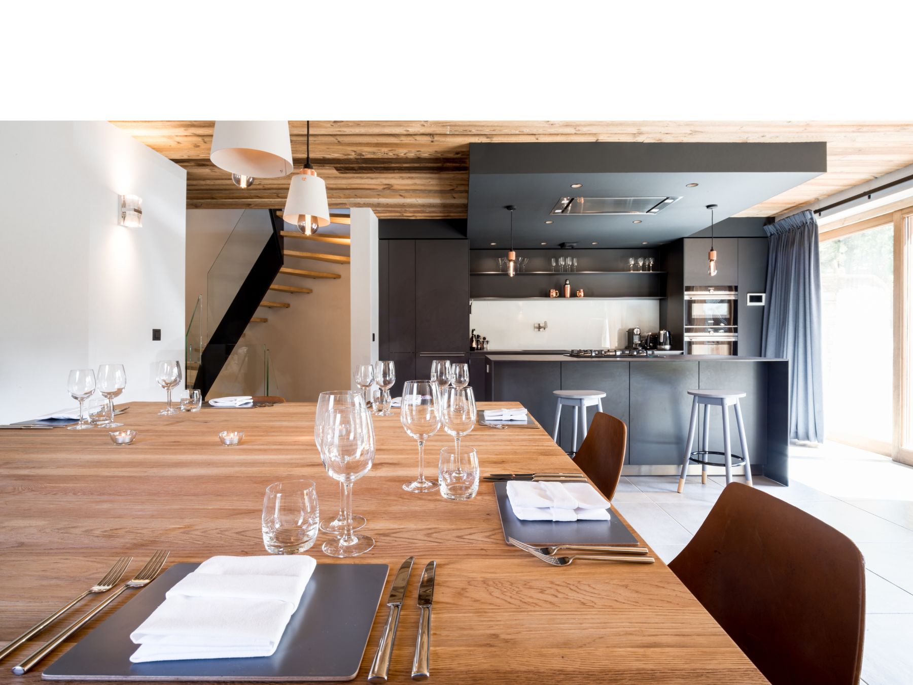Chalet Caro, Meribel - modern kitchen with large dining table