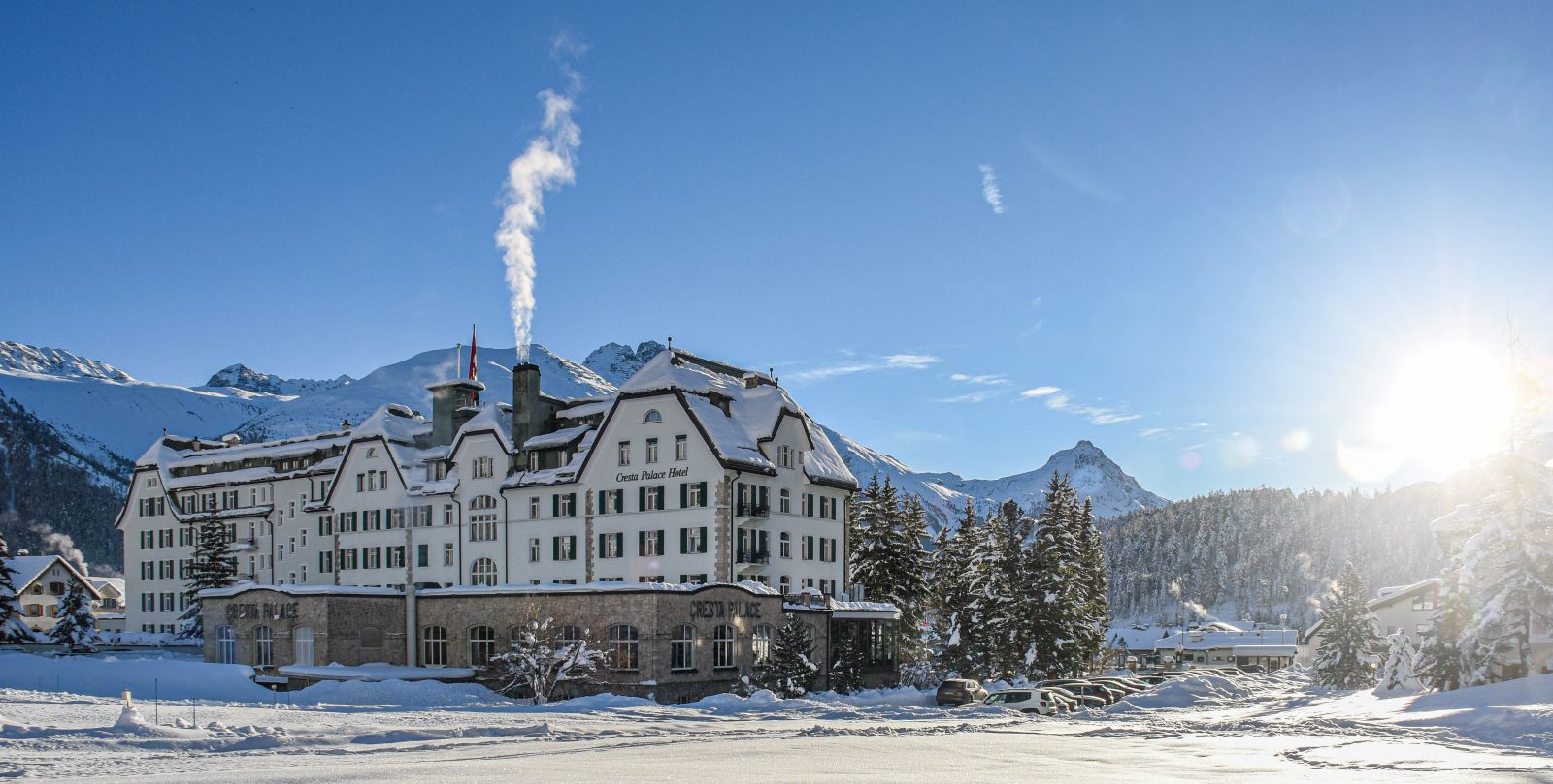 Hotel Cresta Palace, St Moritz - exterior of the hotel with snow covered mountains in the background