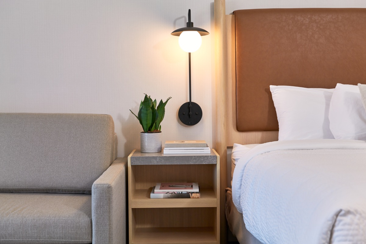 Forest Park Hotel - Sapling Suite detail with sofa, bedside table and bed