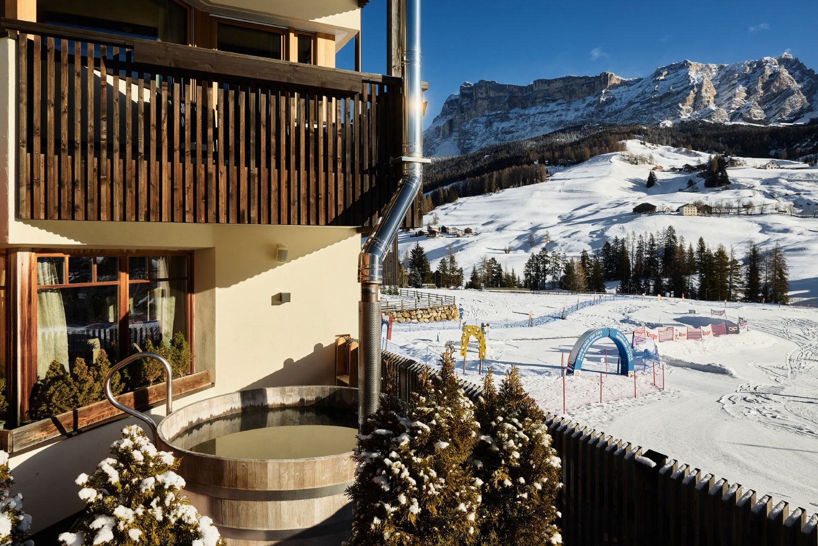 Hotel La Majun, La Villa - view of ski school slopes from the hotel terrace