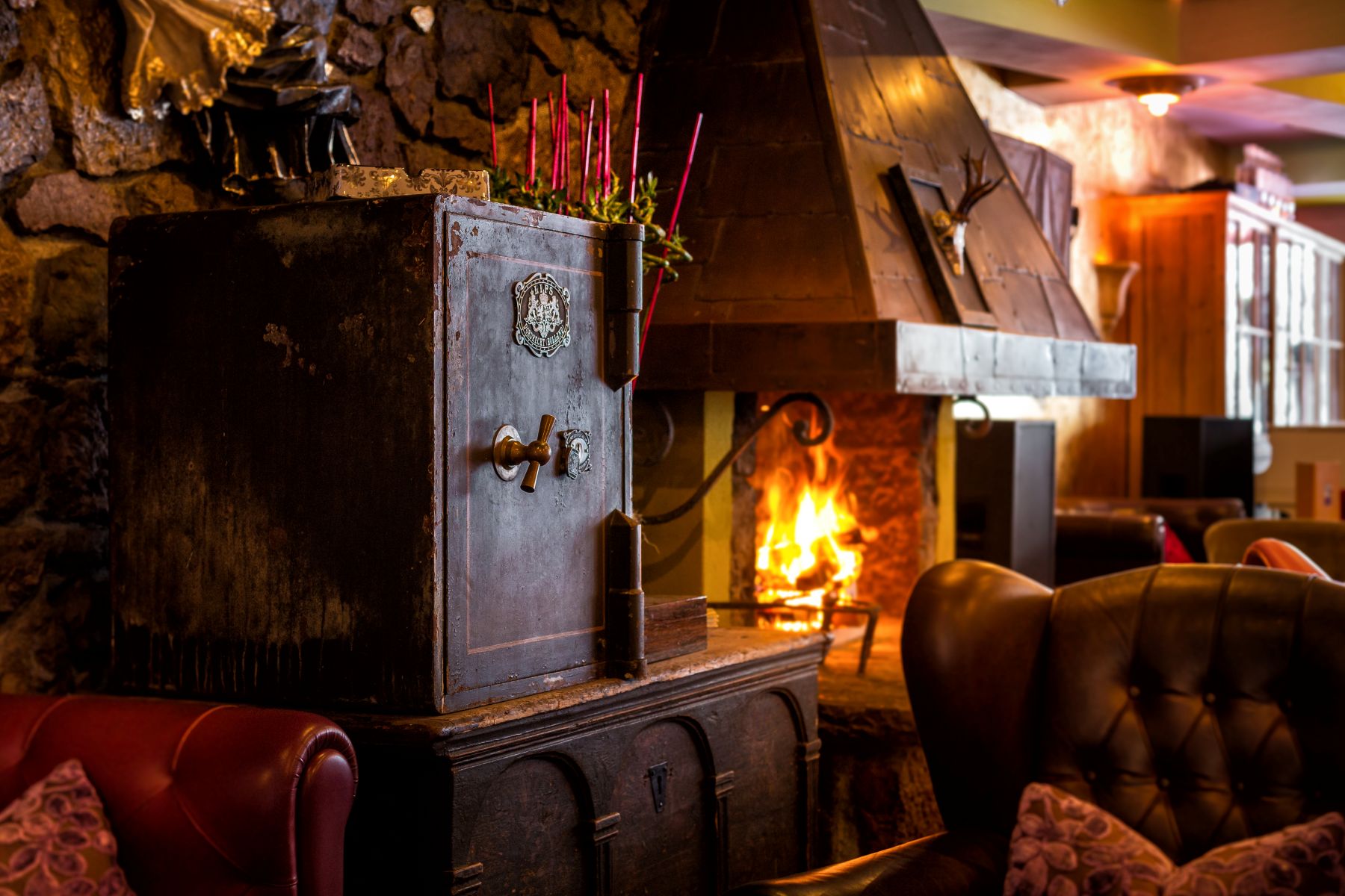 Raffl's St Antoner Hof, St Anton - fireplace in the hotel lobby with comfortable armchairs