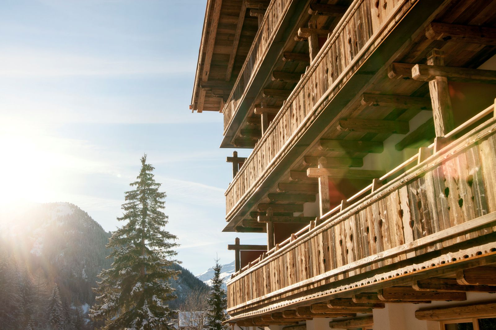 Raffl’s Tyrol Hotel, St Anton - hotel exterior showing mountain and fir tree