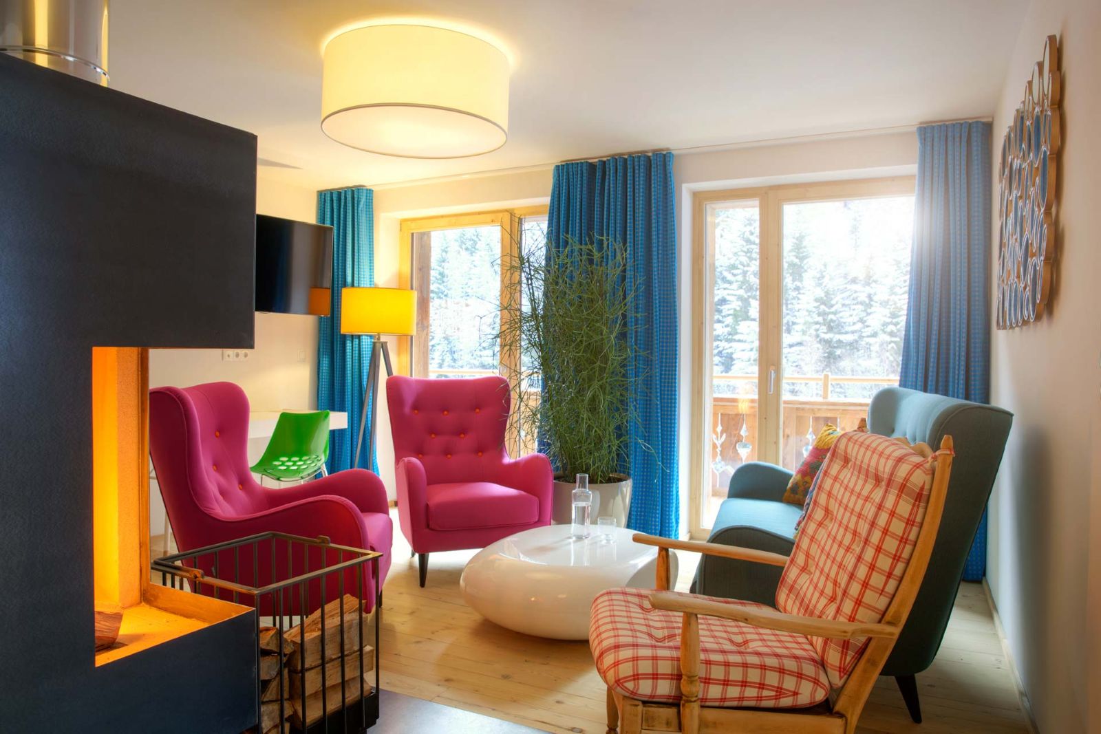 Raffl’s Tyrol Hotel, St Anton - suite with lounge area, open fire and double floor to ceiling windows