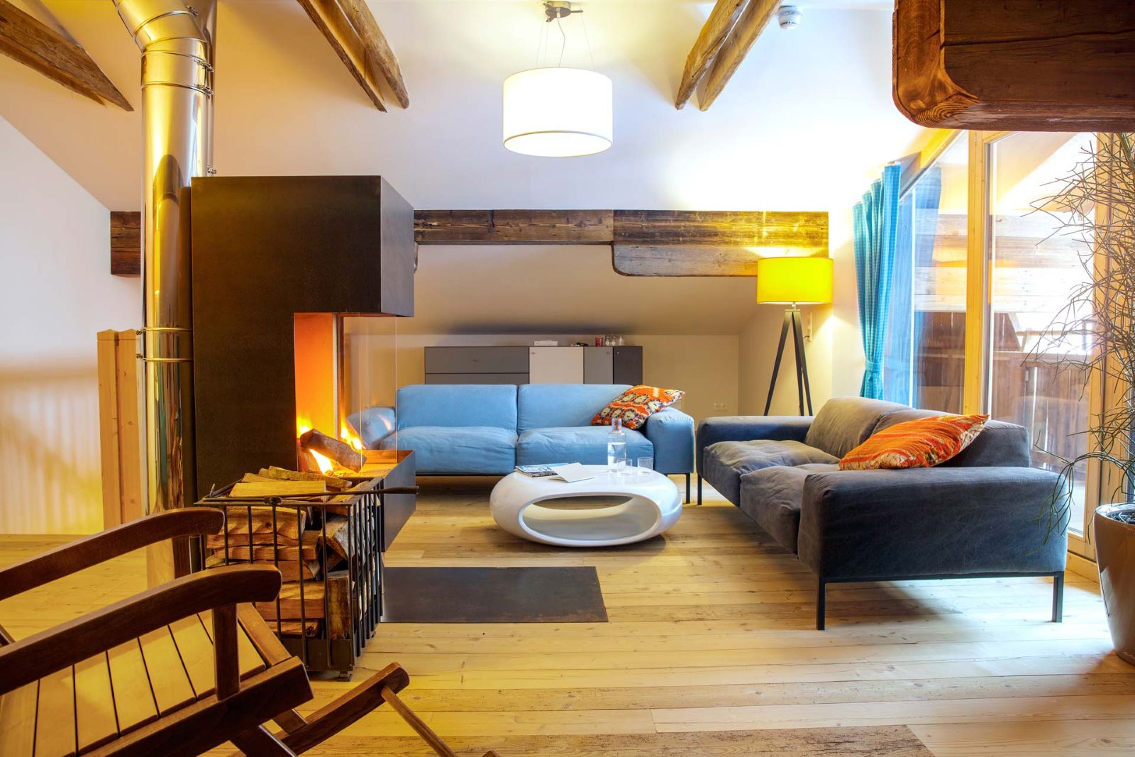 Raffl’s Tyrol Hotel, St Anton - large suite with two sofas and open fire