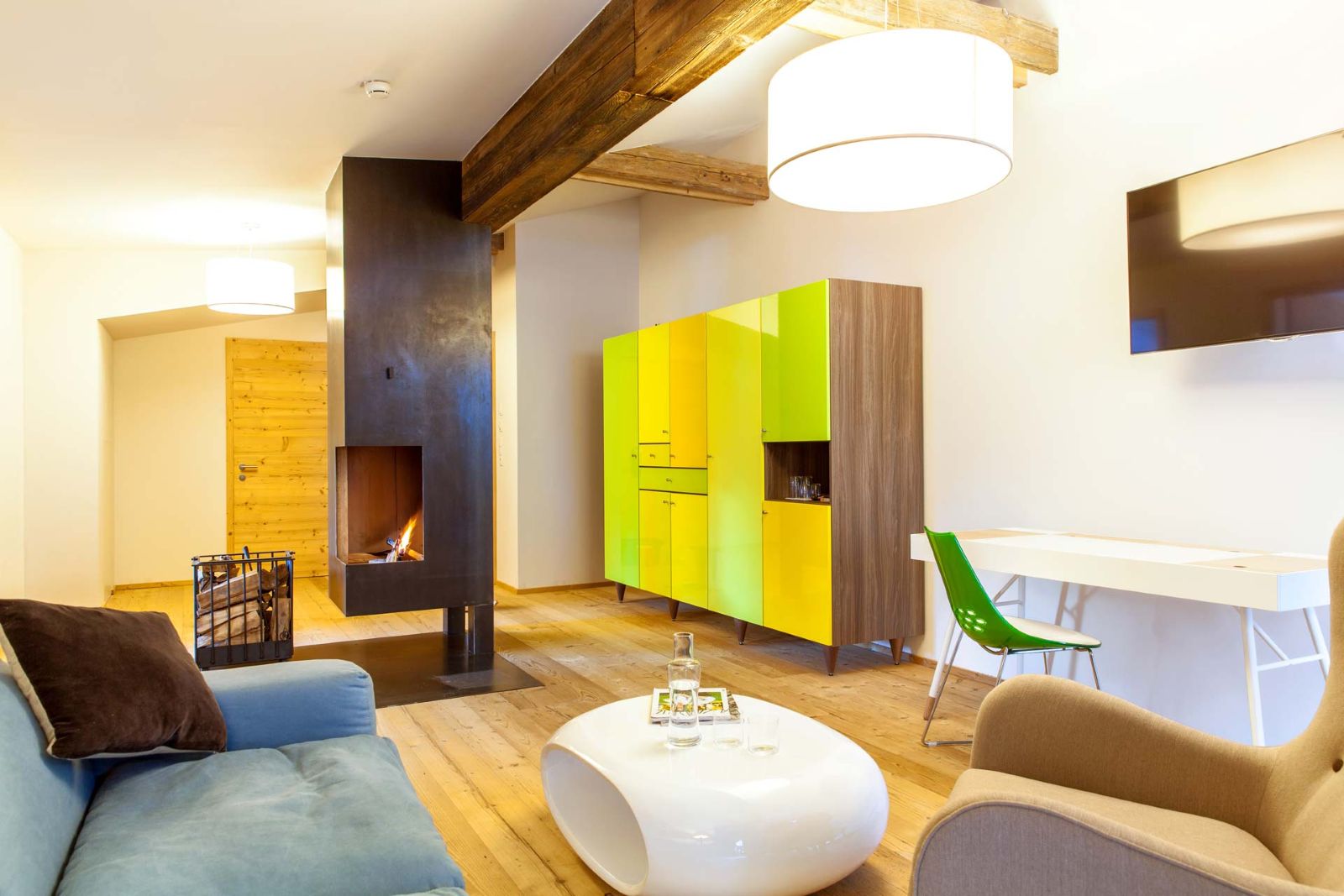 Raffl’s Tyrol Hotel, St Anton - large suite with comfortable seating and fire