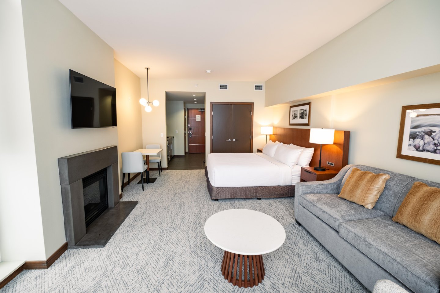 Sutton Place Hotel Revelstoke, open plan lounge, kitchenette, renovated suite
