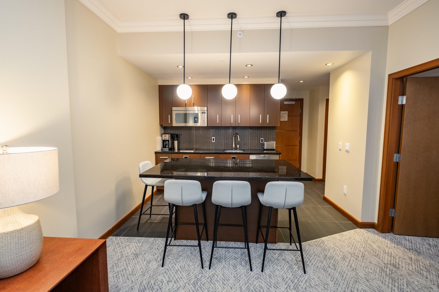 Sutton Place Hotel Revelstoke, kitchen, breakfast bar, renovated suite