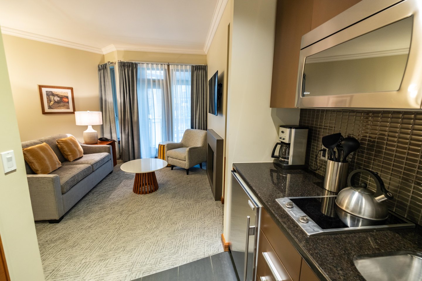 Sutton Place Hotel Revelstoke, open plan lounge, kitchenette, renovated suite