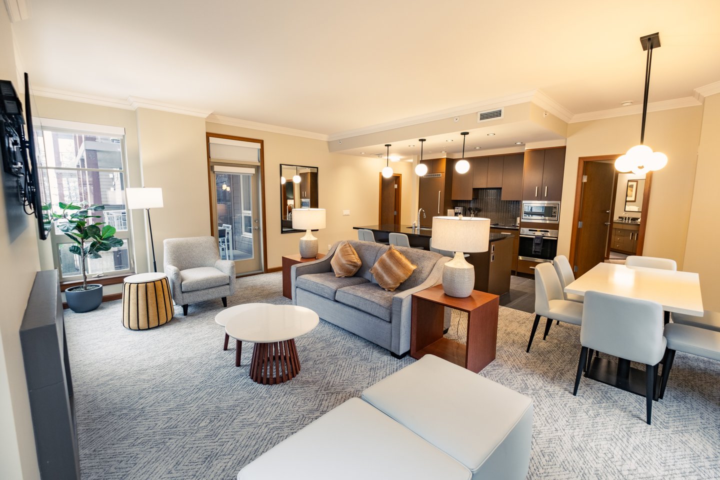 Sutton Place Hotel Revelstoke, open plan lounge, kitchen, renovated suite