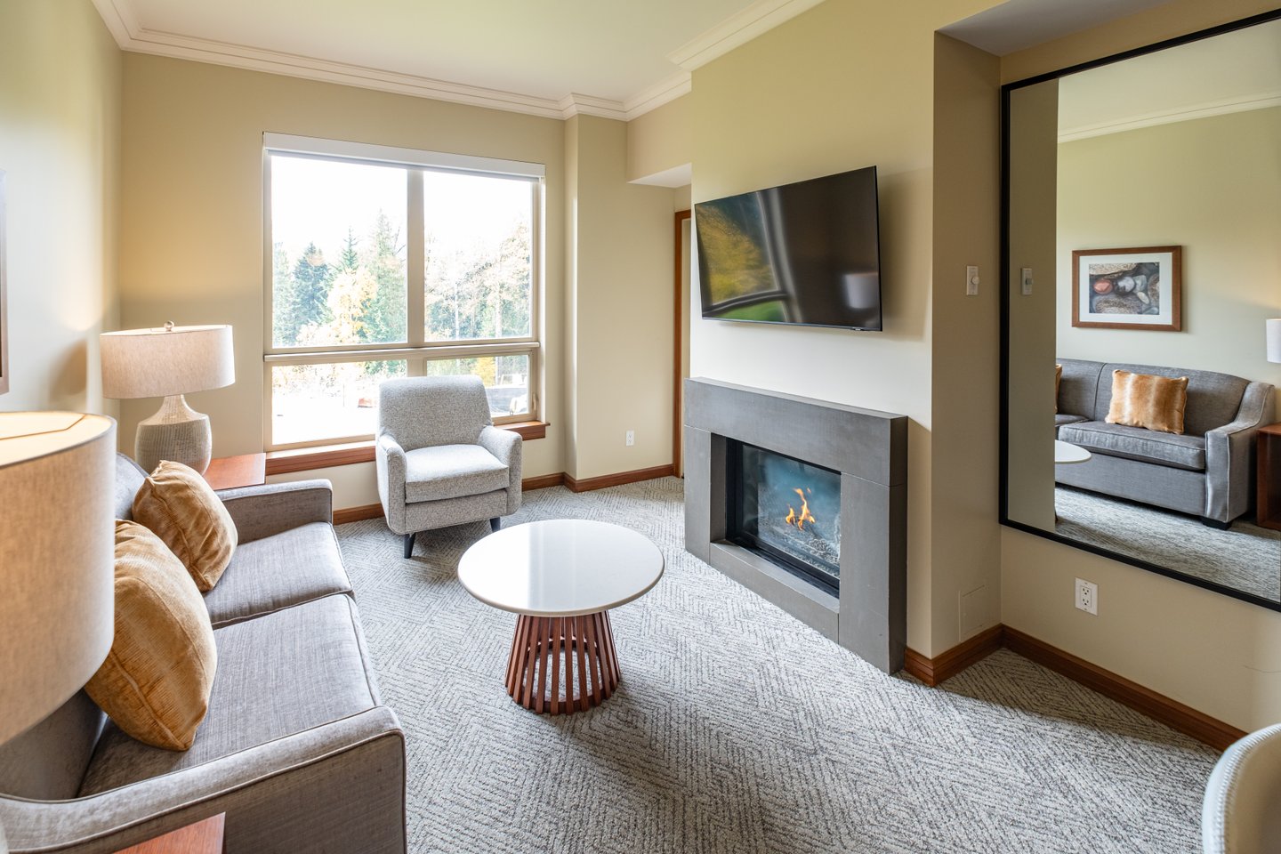 Sutton Place Hotel Revelstoke, living room, fireplace, bedroom, renovated suite