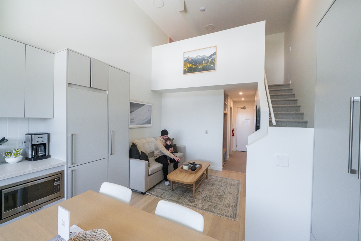 Red Mountain Resort, The Crescent - family sitting in the living space of the loft condo
