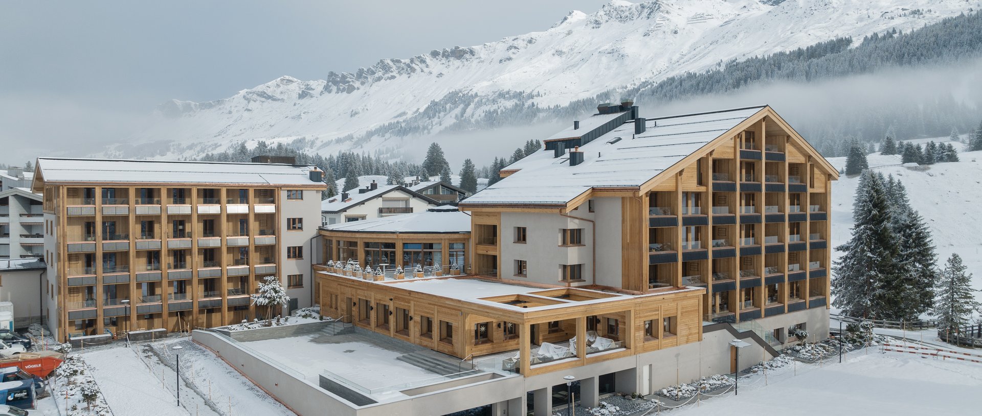 Valbella Resort Lenzerheide - resort exterior with snow-covered mountains behind