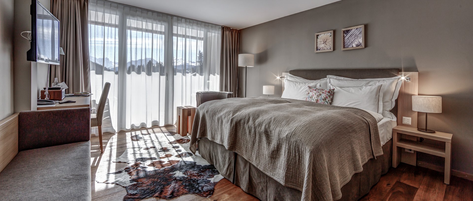 Valbella Resort Lenzerheide - bright and modern bedroom with light flooding in