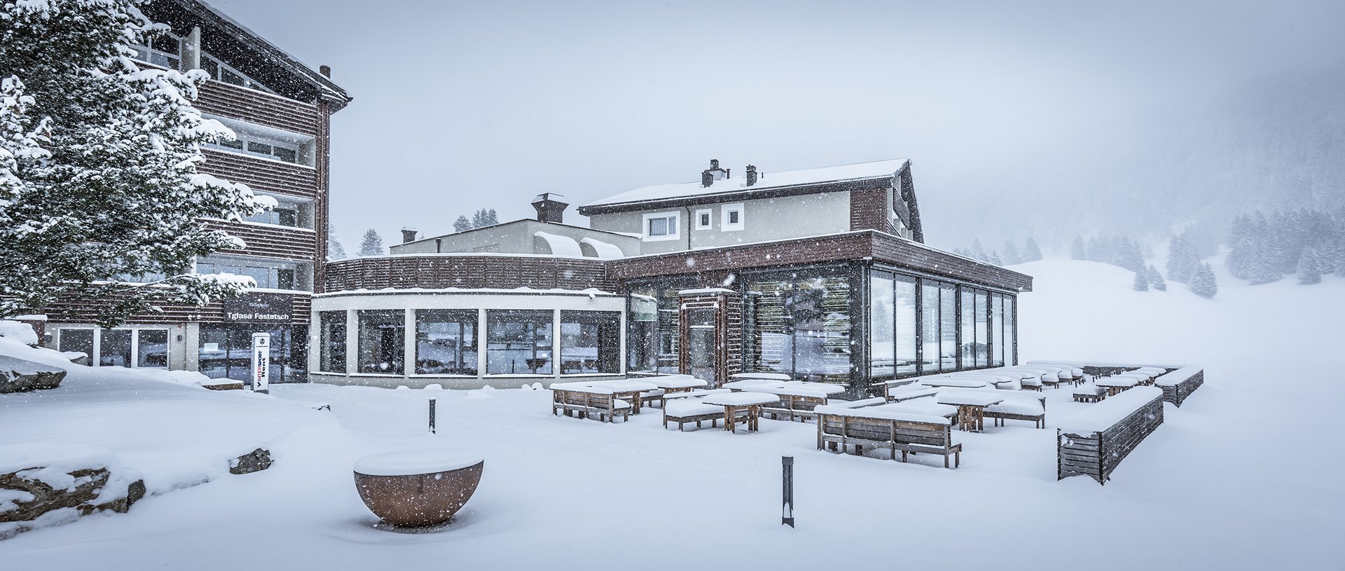 Valbella Resort Lenzerheide - resort exterior on a snowy day