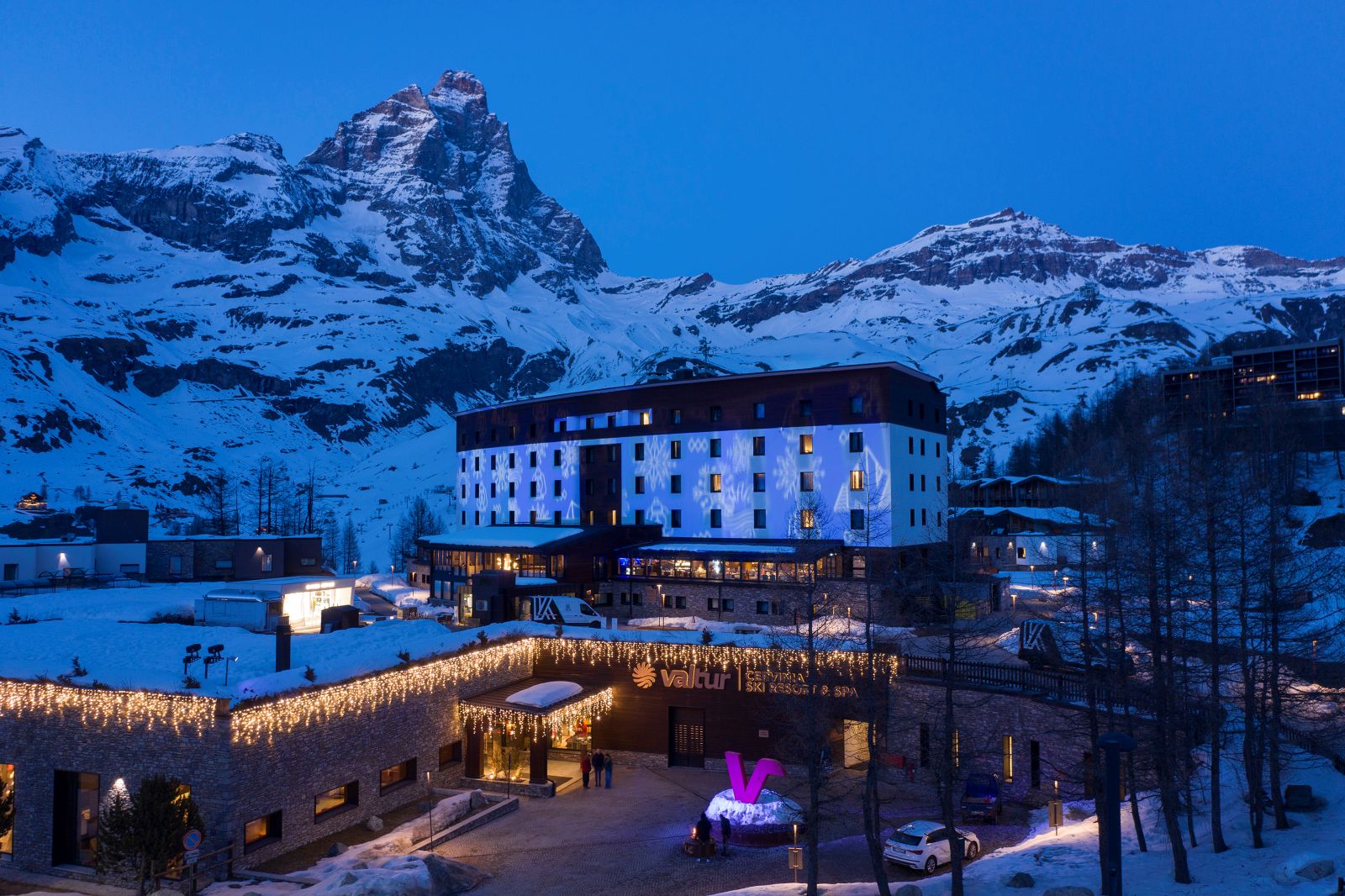 Valtur Cervinia Cristallo - hotel exterior at dusk with Matterhorn in the background
